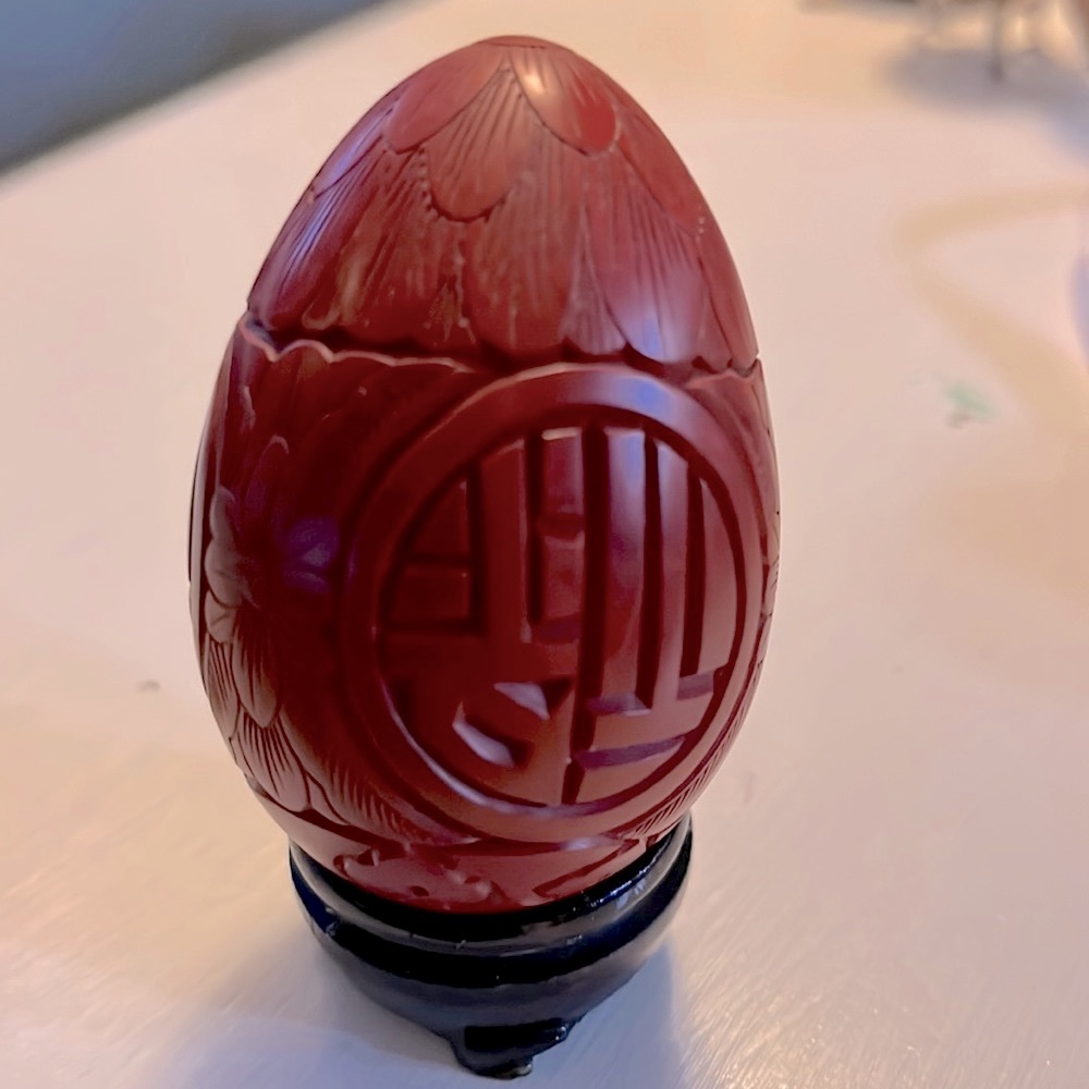 Vintage hand carved Chinese egg with wooden base